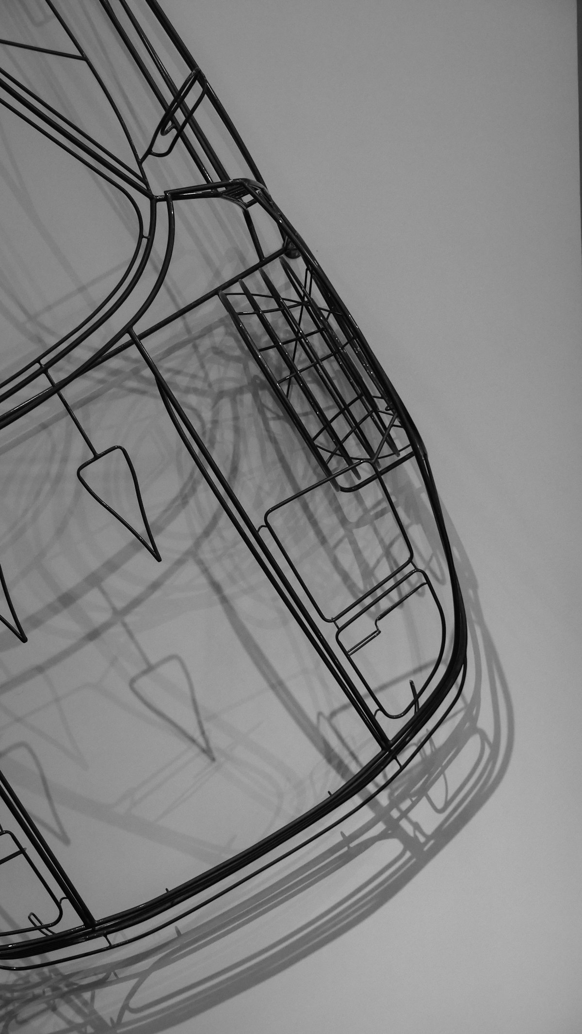 Black and white line drawing of a car body design